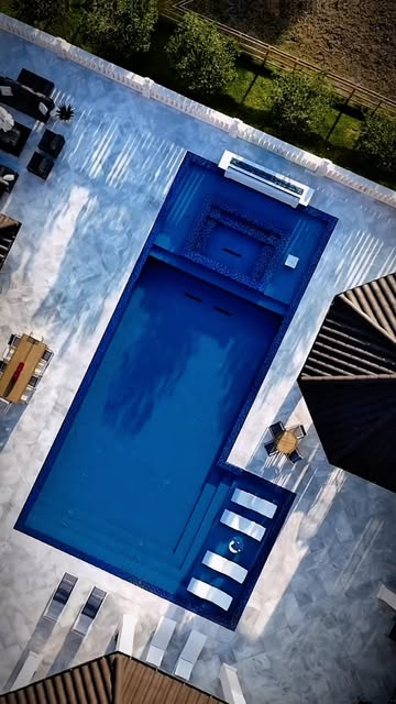 Aerial view of white paver pool deck