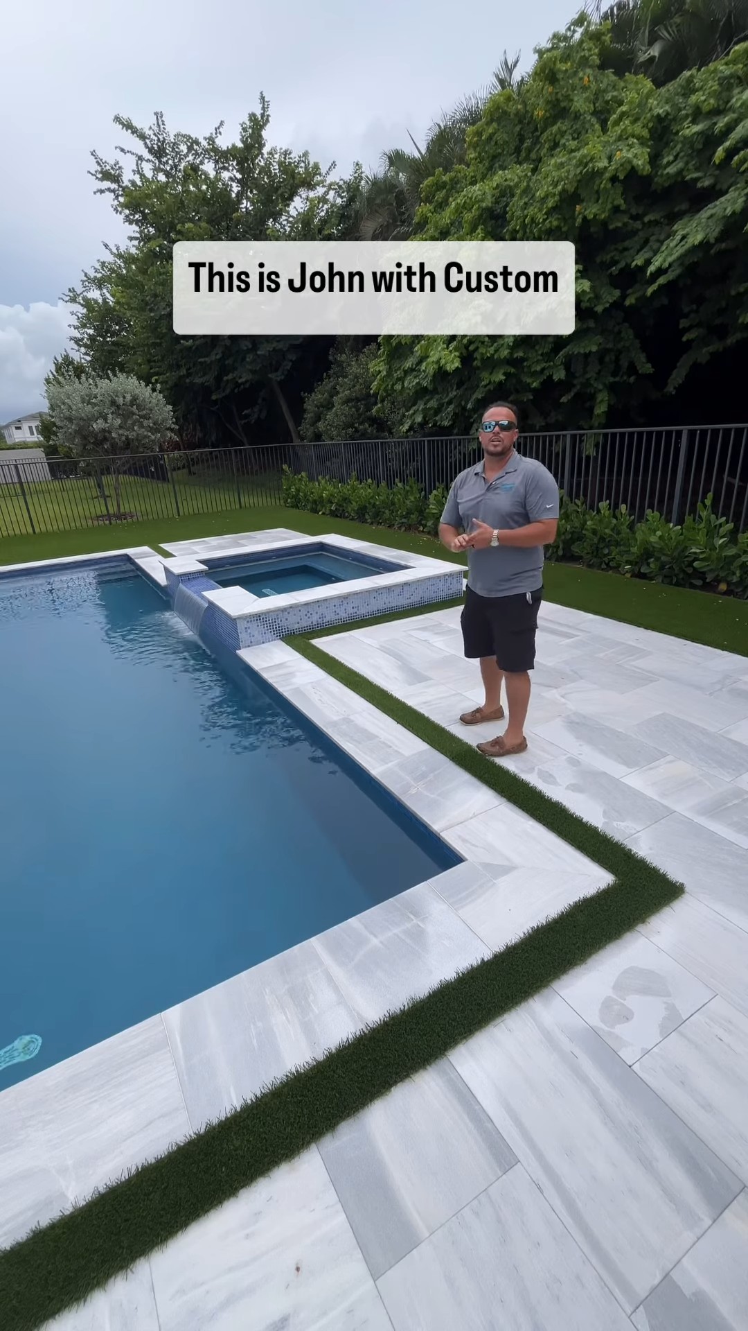 Luxury pool with spa, artificial turf, and paver decking in Boca Raton, FL