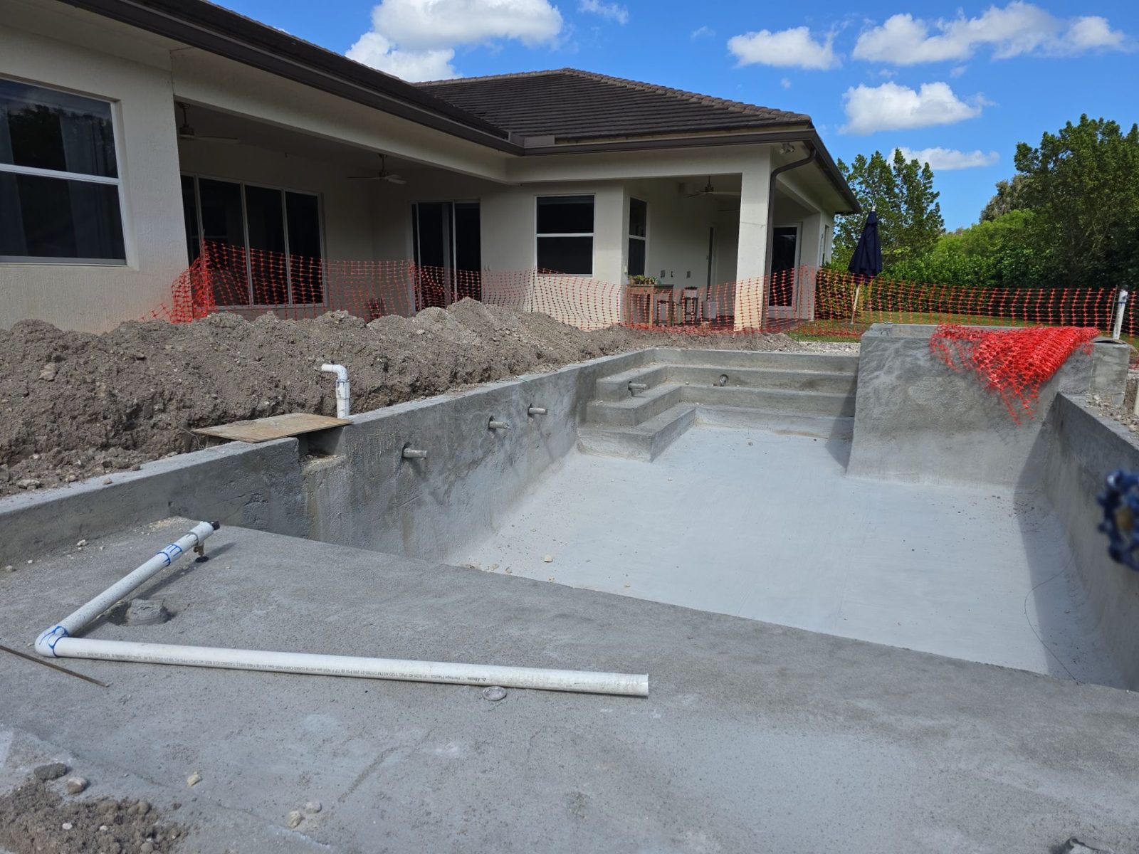 Shotcrete pool shell and raised spa under construction in Davie, Florida