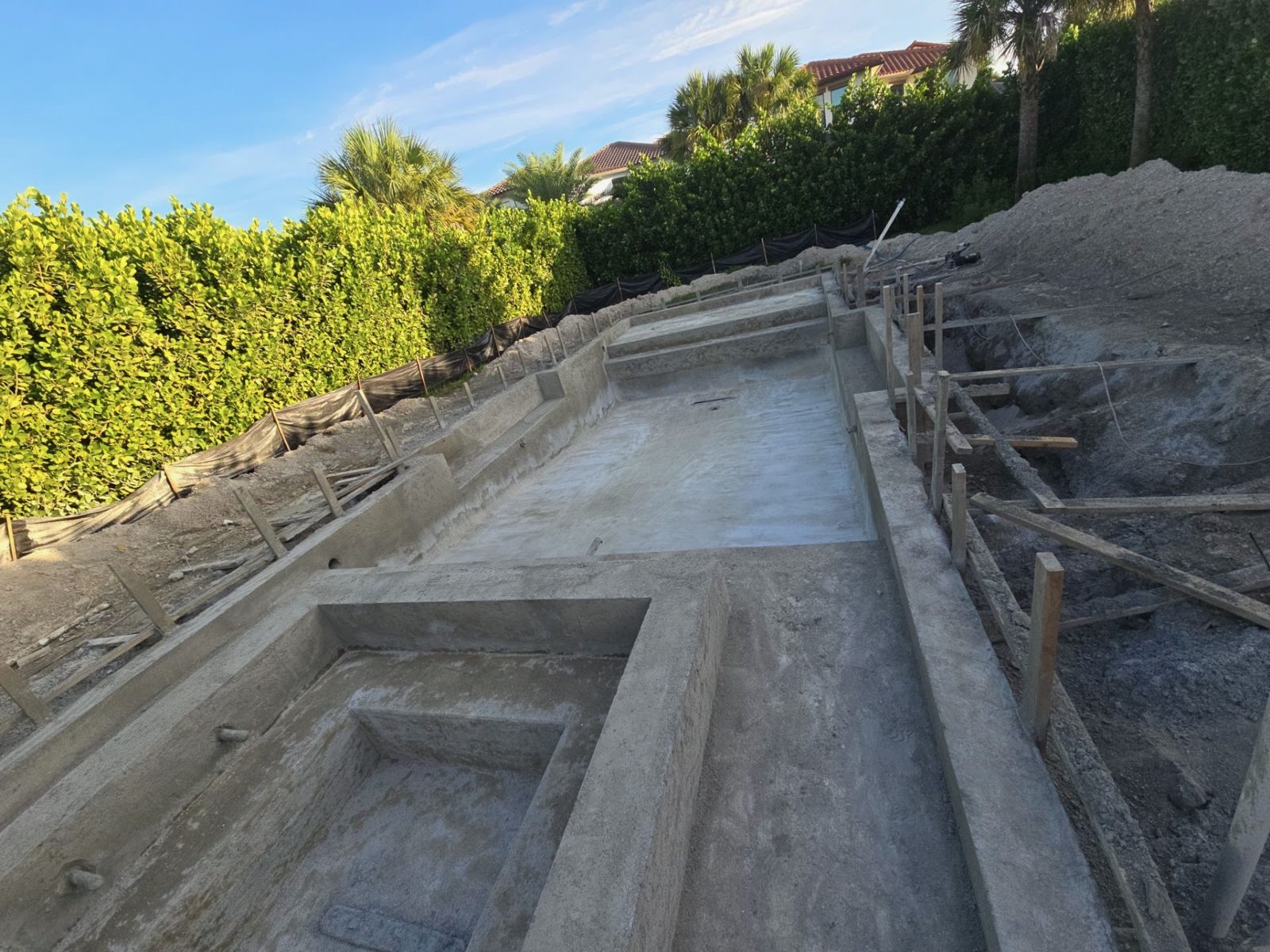 Pool shell, benches and sun shelf under construction in Parkland, Florida