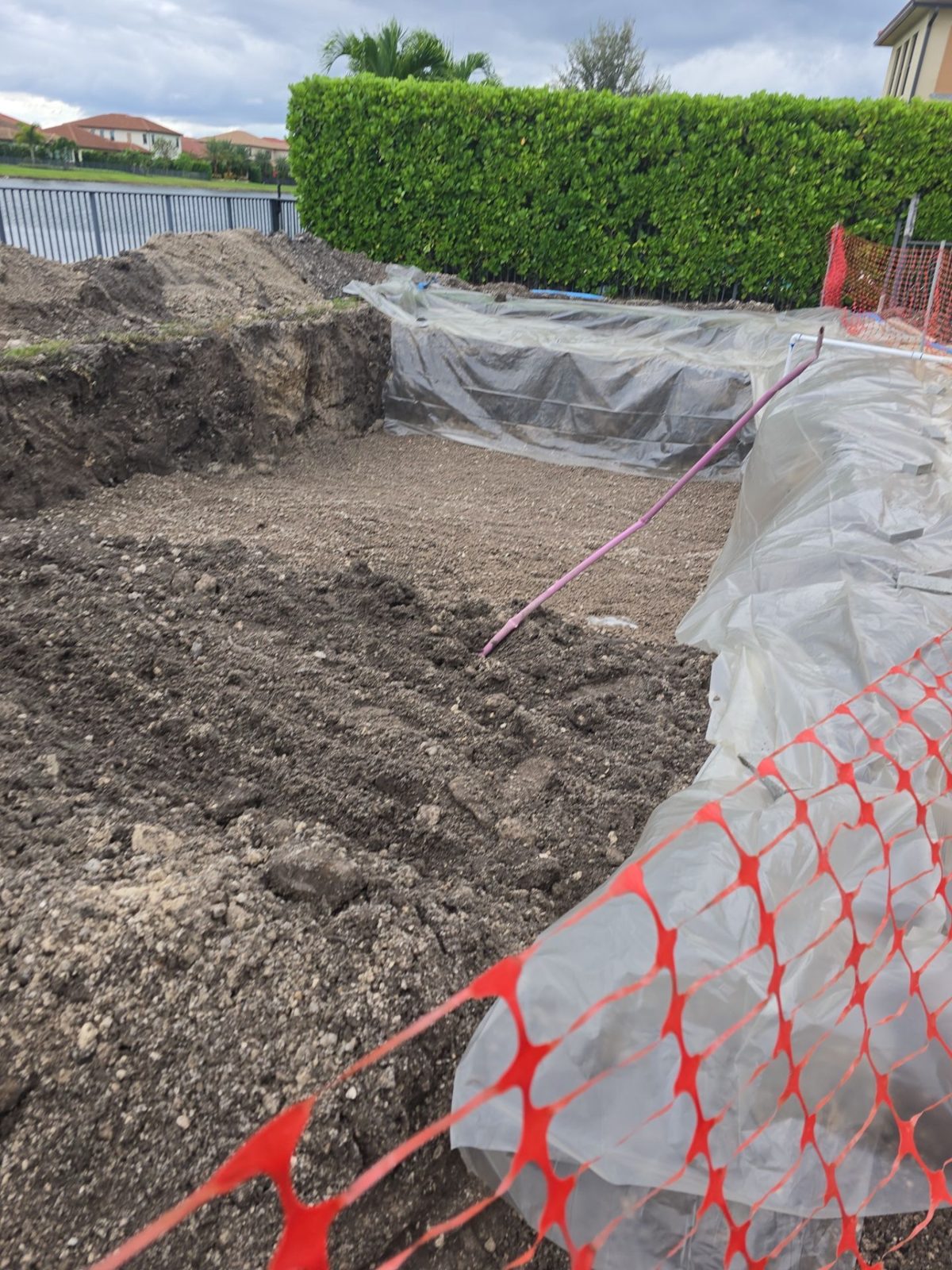 Excavation for a small pool on a tight-access lot in Parkland, Florida